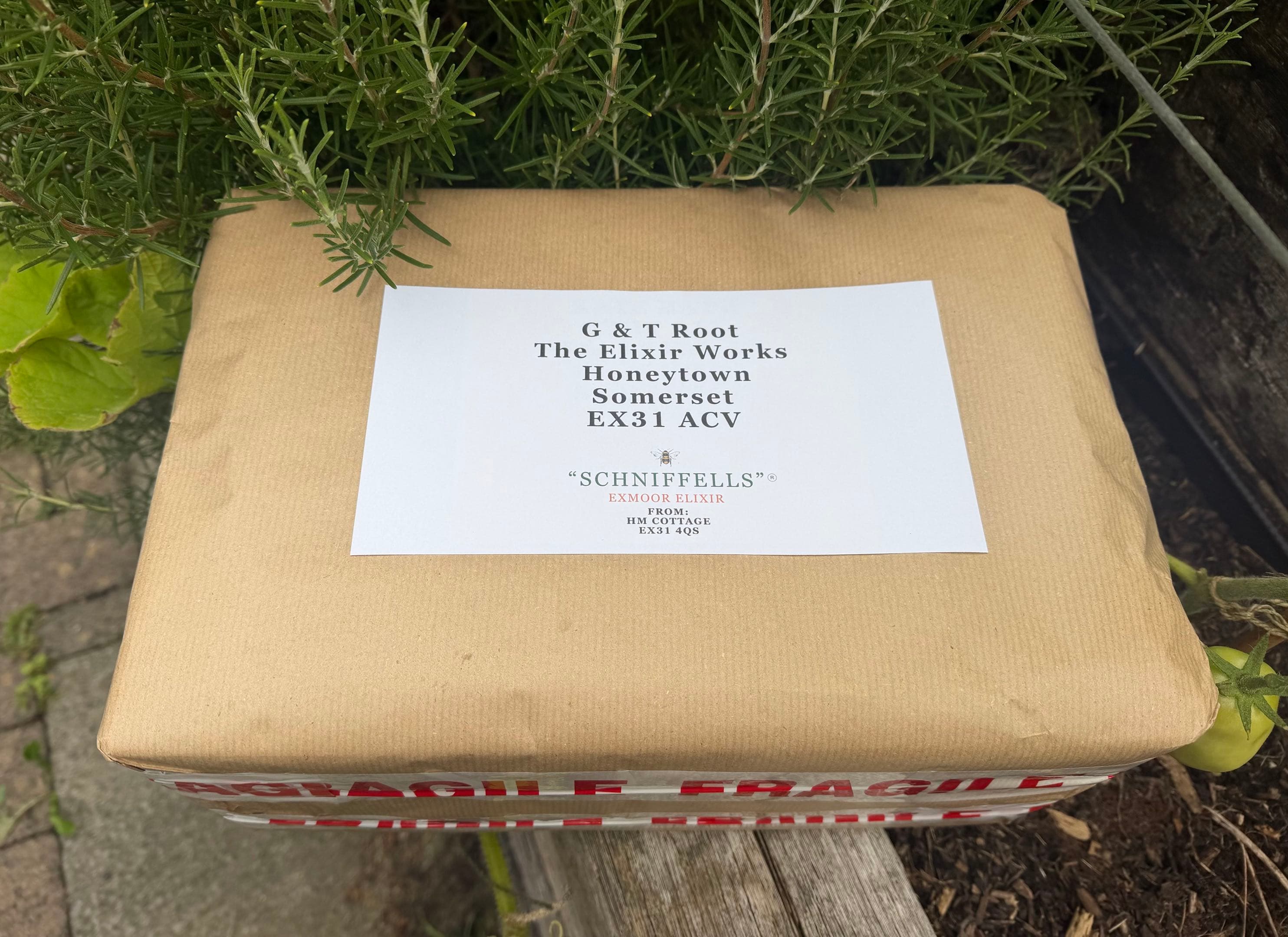 A Schniffells case addressed to G & T Root, The Elixir Works, Honeytown, Somerset EX31 ACV, ready to post