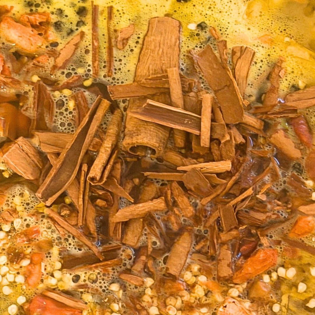 Botanicals steeping in the amber brew